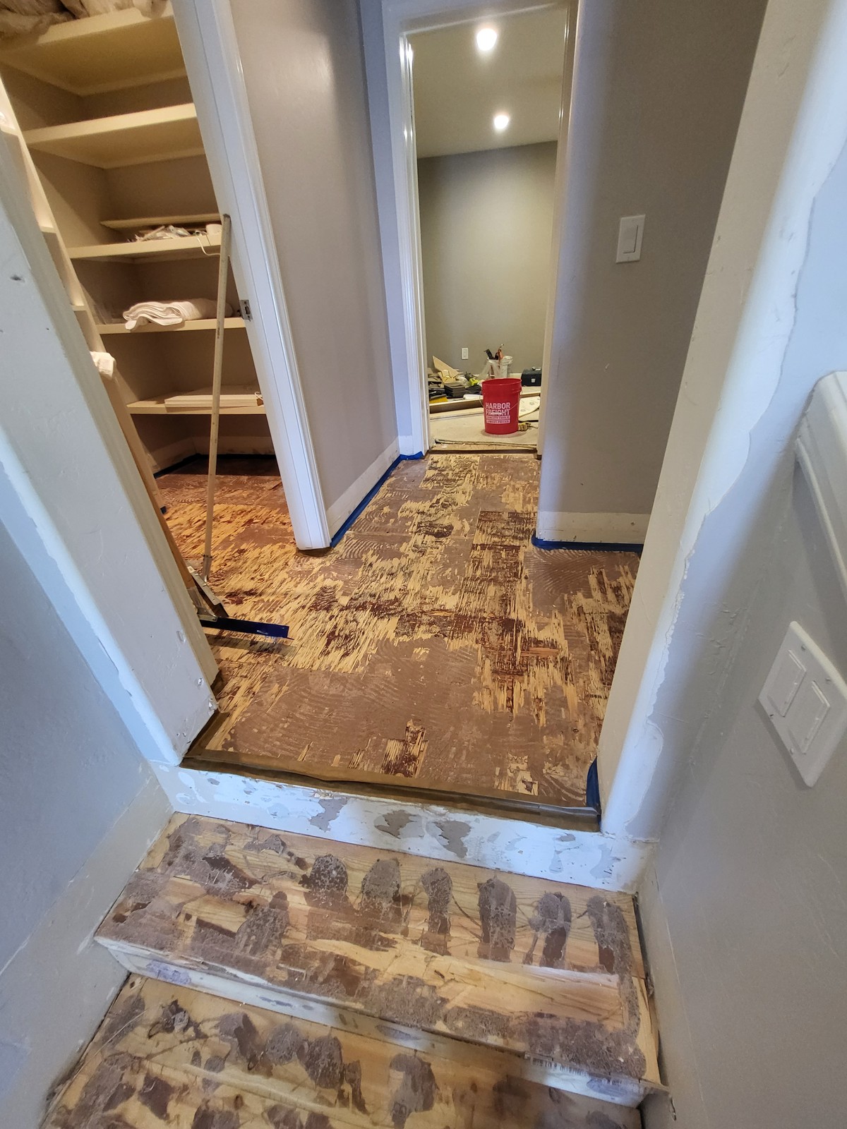 Hallway stripped down to the subfloor