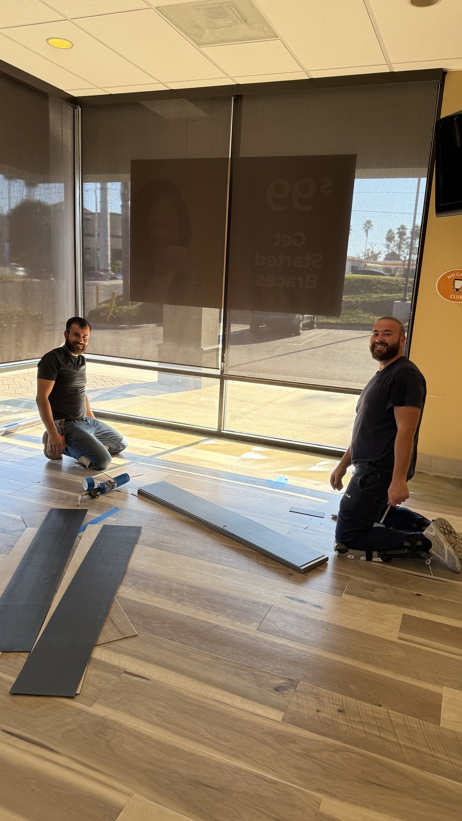 Zelo installers laying vinyl plank flooring